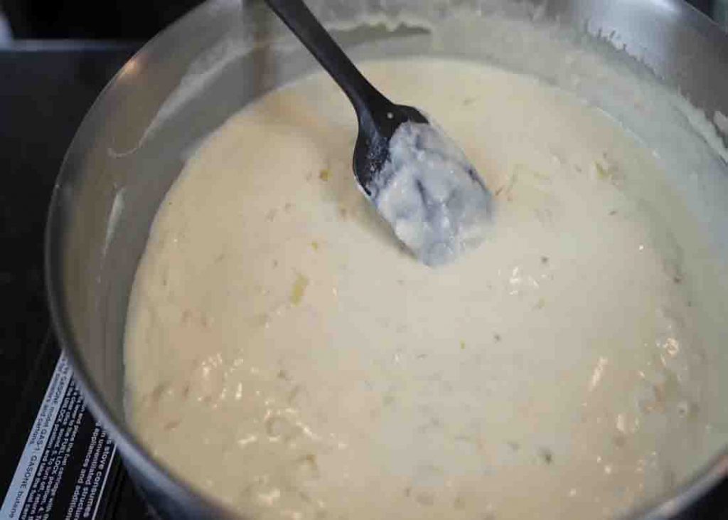 Combining the ingredients for the broccoli and cheese casserole recipe