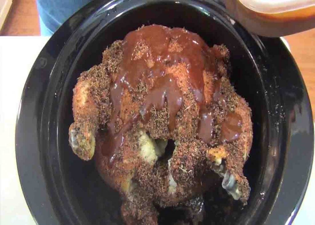 Adding bbq sauce to the crock pot beer can chicken