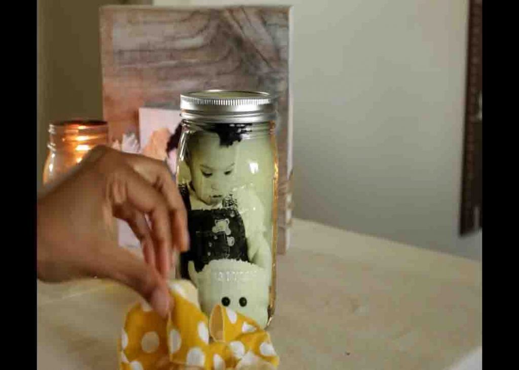 Designing the mason memory photo jar with some ribbons and lace