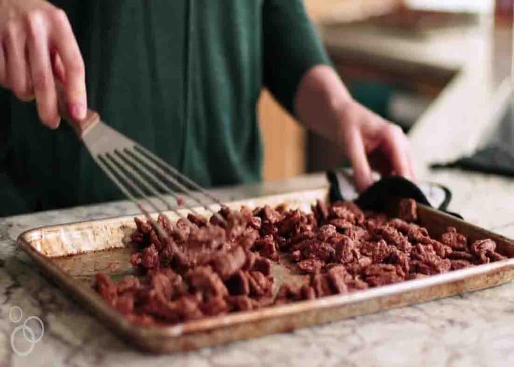 Baking the cinnamon and sugar candied pecans