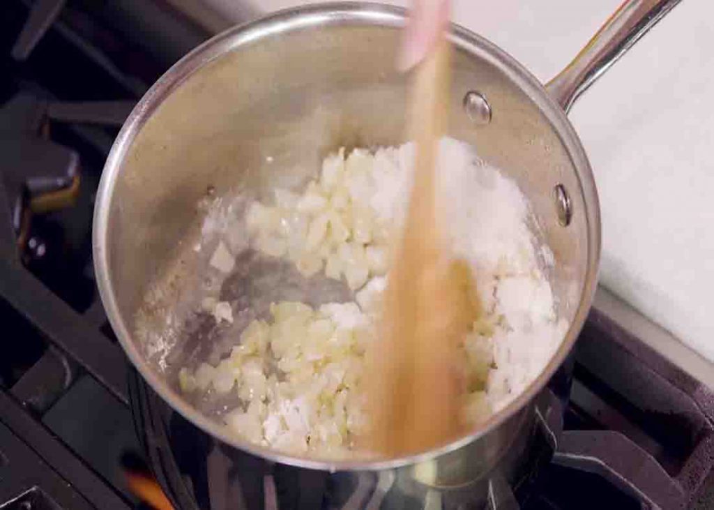 Sauteing the onions for the creamy chicken casserole recipe