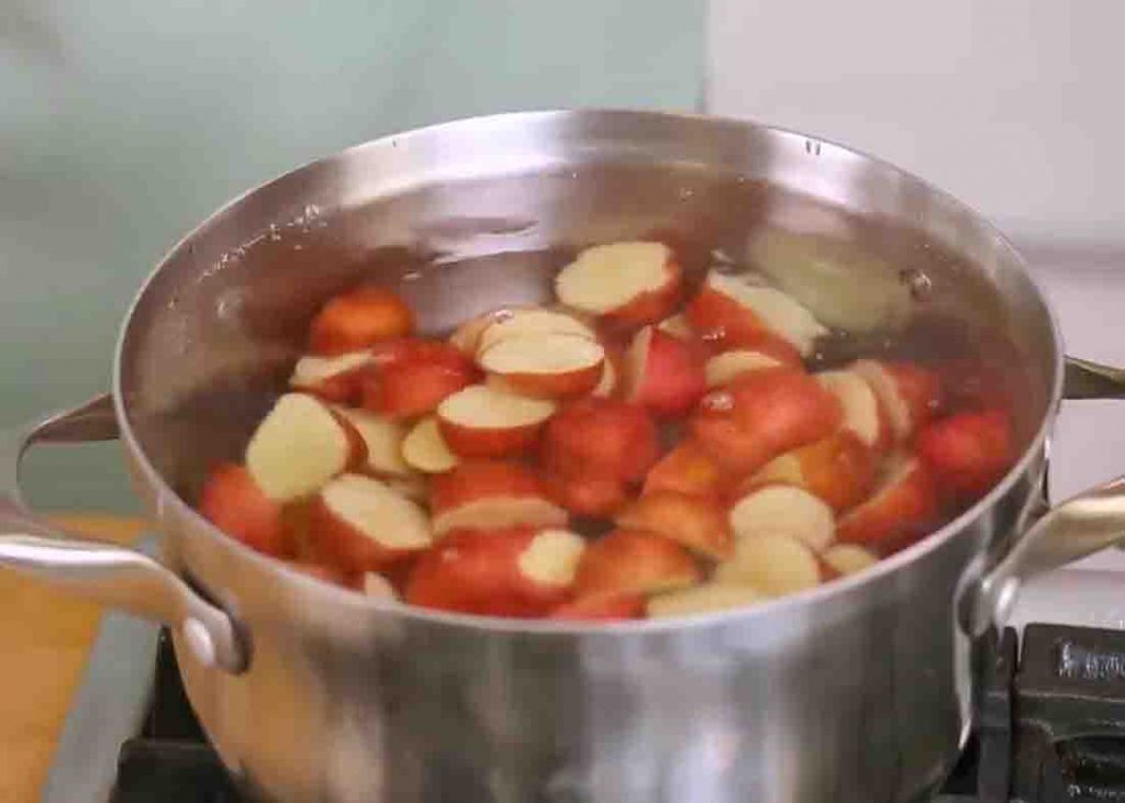 Parboiling the potatoes before roasting them