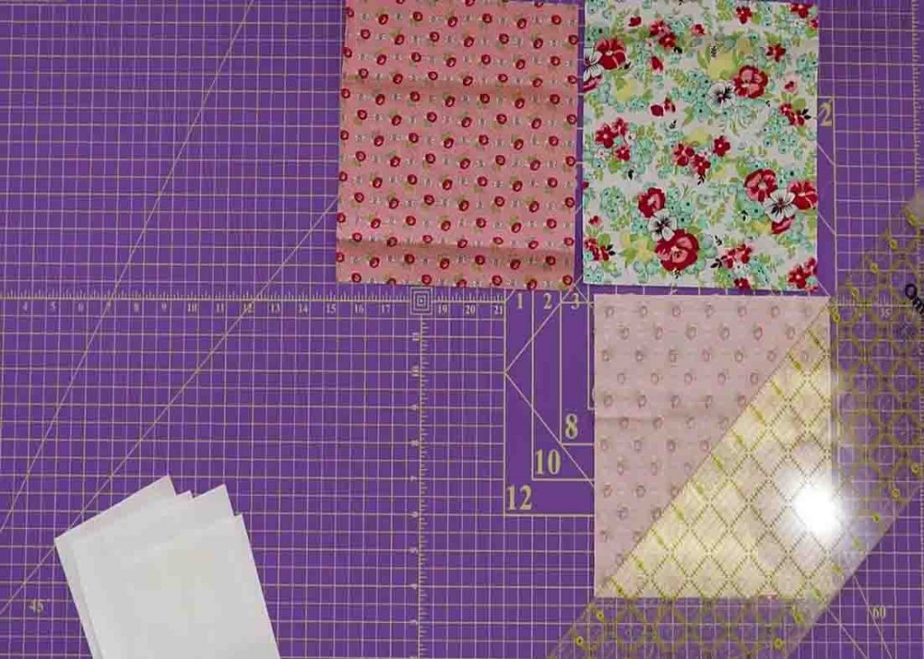 Cutting and sewing the half square triangles for the fat quarter fancy quilt