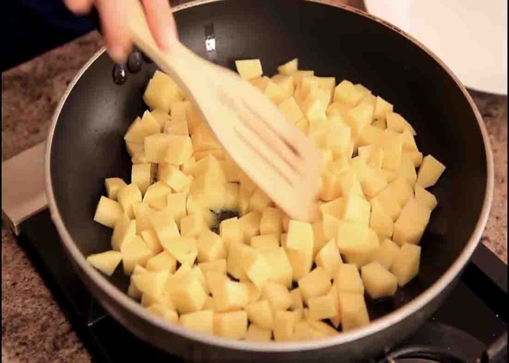 Cooking the potatoes for the homemade potato hash recipe