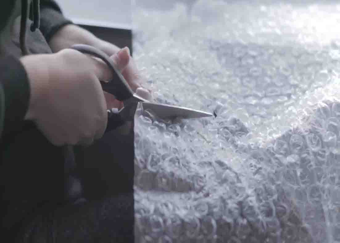 Putting bubble wrap to your windows to keep the house warm during the winter season