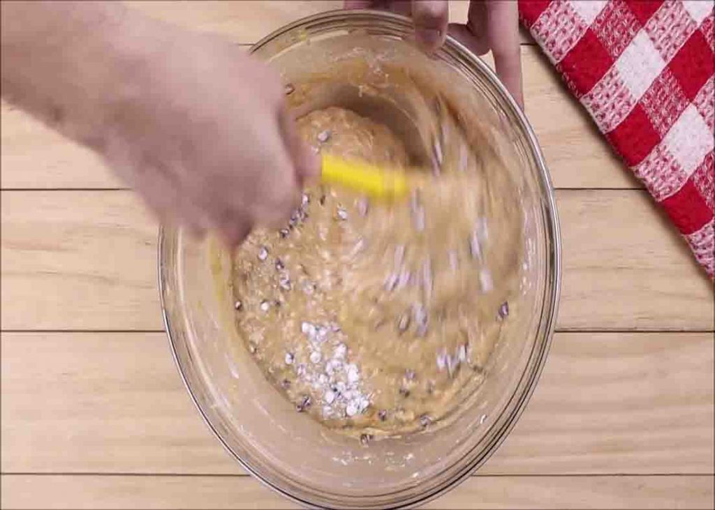 Mixing the banana chocolate chip loaf ingredients