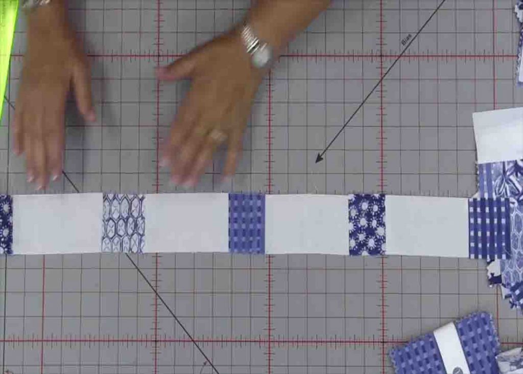 Sewing the rows of simple squares quilt together