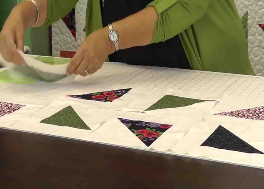 Laying the triangle blocks together to make the falling triangles quilt