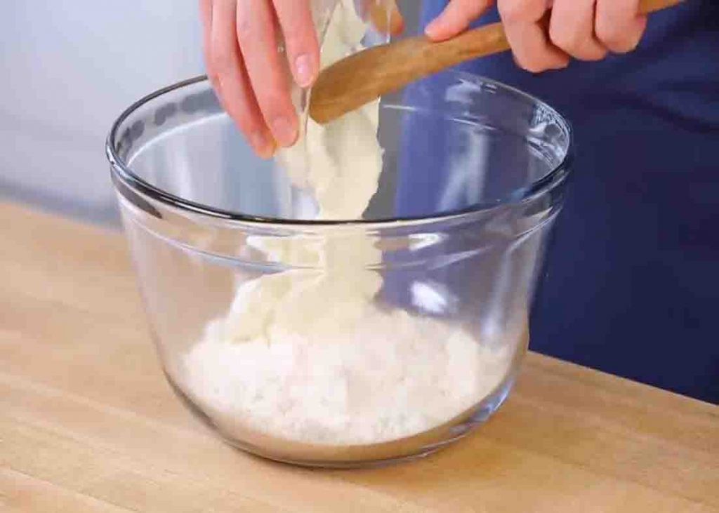 Combining the two ingredients to make the bagels