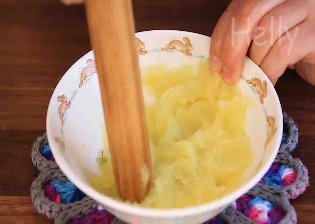 Mashing the potato for the potato buns recipe
