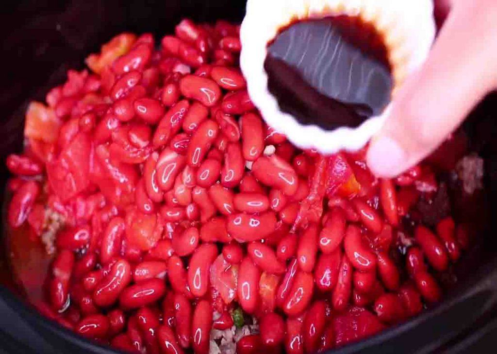 Adding the chili mixture in the slow cooker