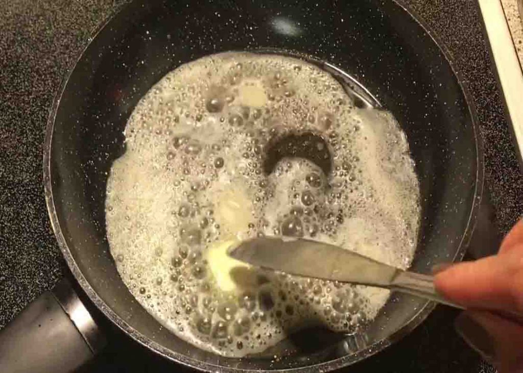 Melting the butter for the garlic butter spinach