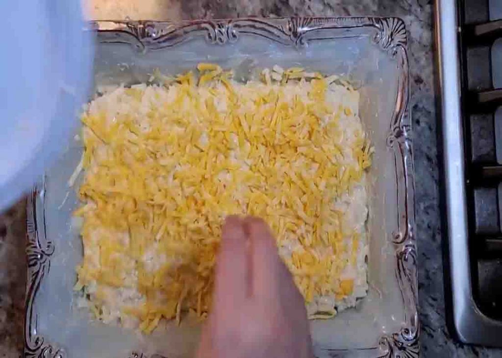 Assembling the hashbrown casserole