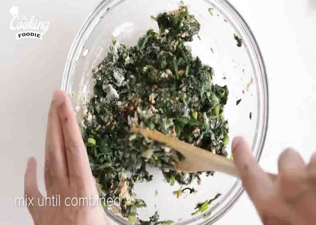 Mixing the ingredients for the spinach patties