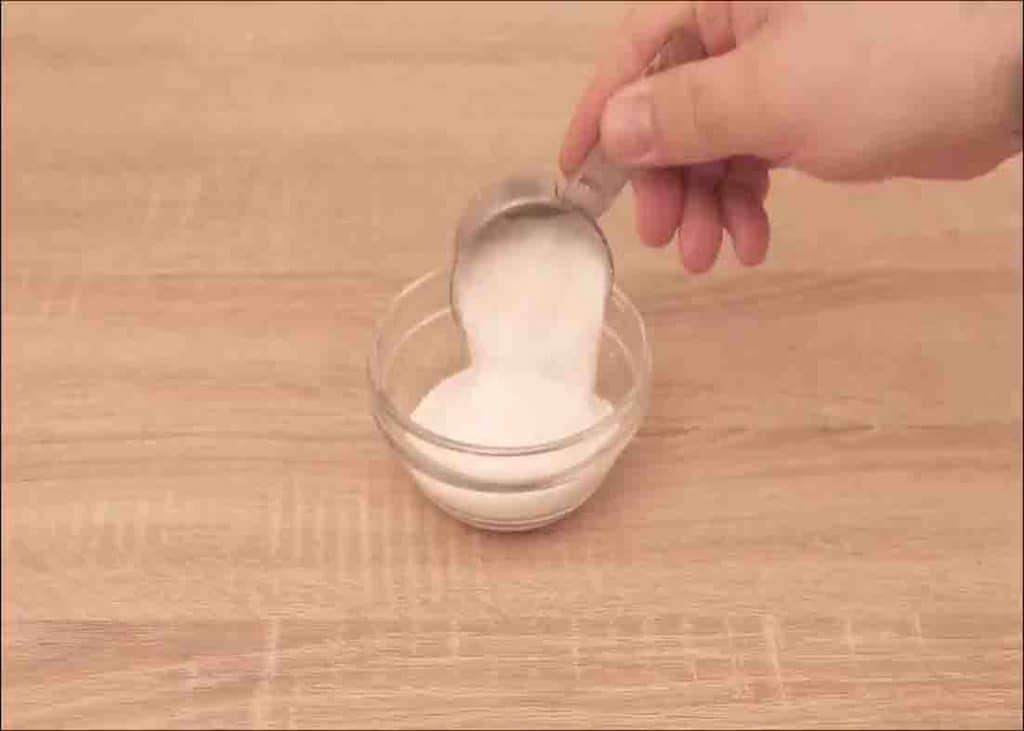 Filling the bowl with baking soda for the DIY home fragrant dispenser