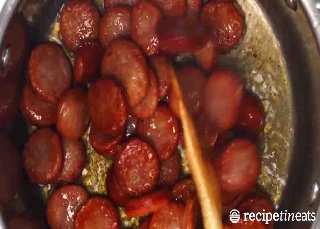 Cooking the smoked sausage for the sausage and rice one-pot recipe