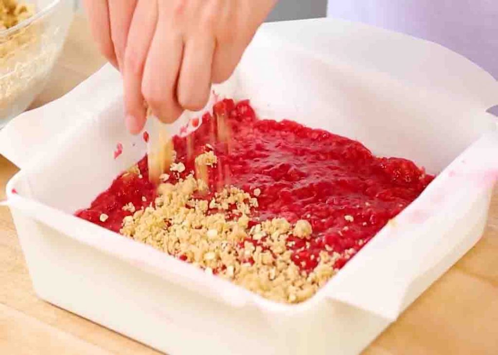 Assembling the raspberry oat crumble bars