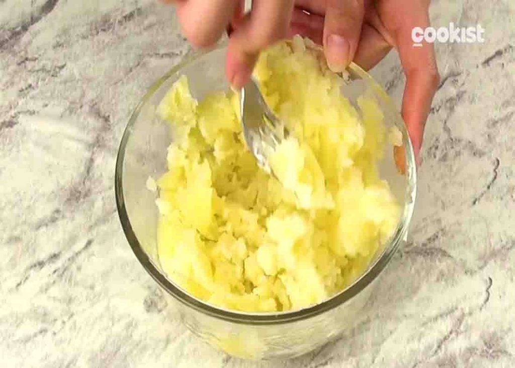 Mashing the potatoes for the homemade potato chips