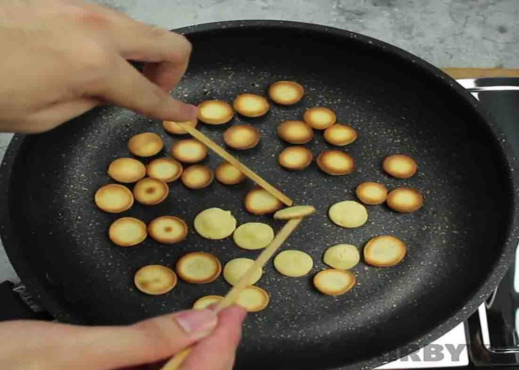 Cooking the mini pancakes for the pancake cereal recipe