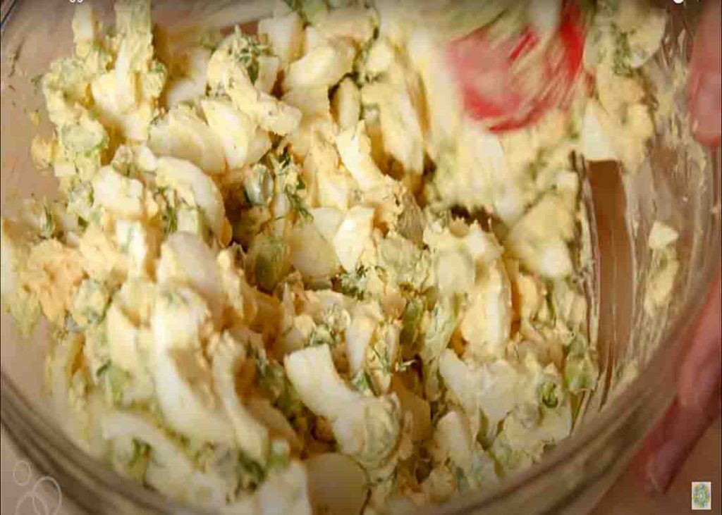 Mixing the egg salad recipe