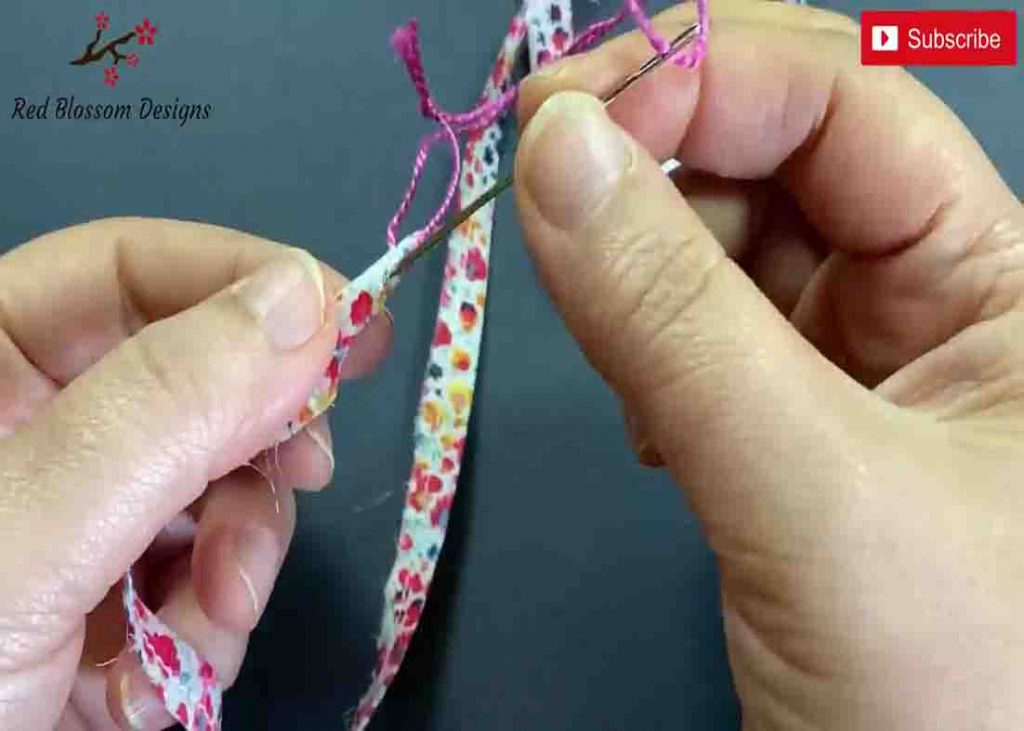 Putting the string through the fabric strip