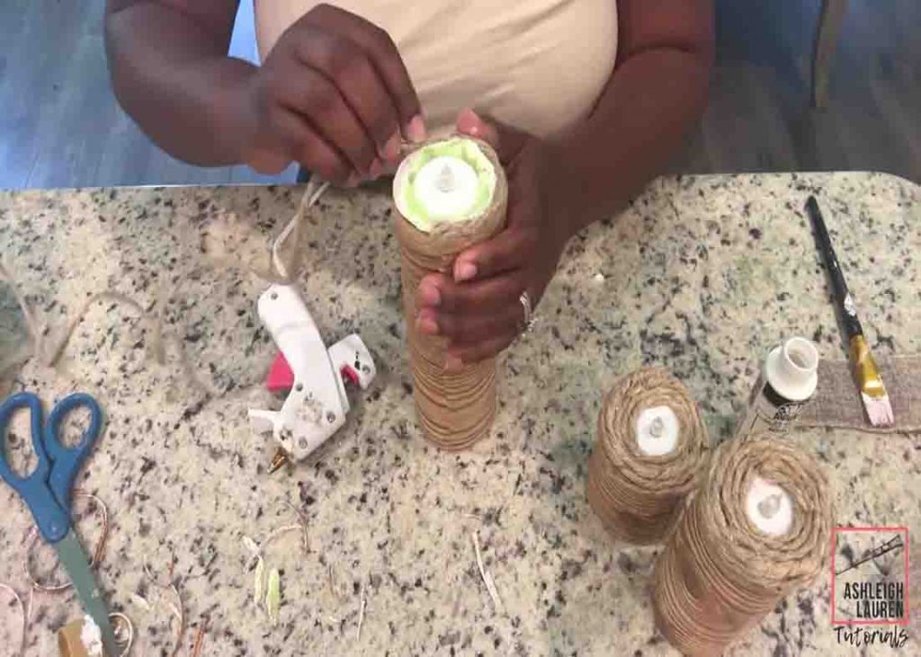 Decorating the DIY LED candles with twine and burlap