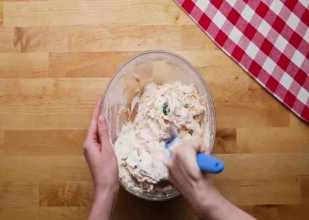 Mixing all the ingredients for the cheddar jalapeno bread recipe