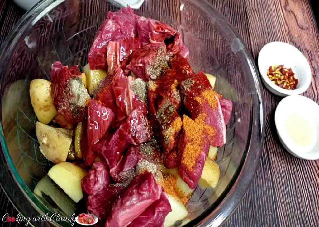 Combining all the ingredients for the garlic herb steak and potatoes recipe