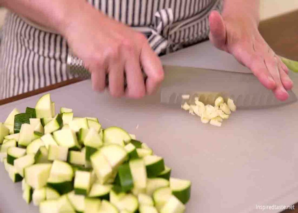 Chopping the ingredients for the butter garlic sauteed zucchini