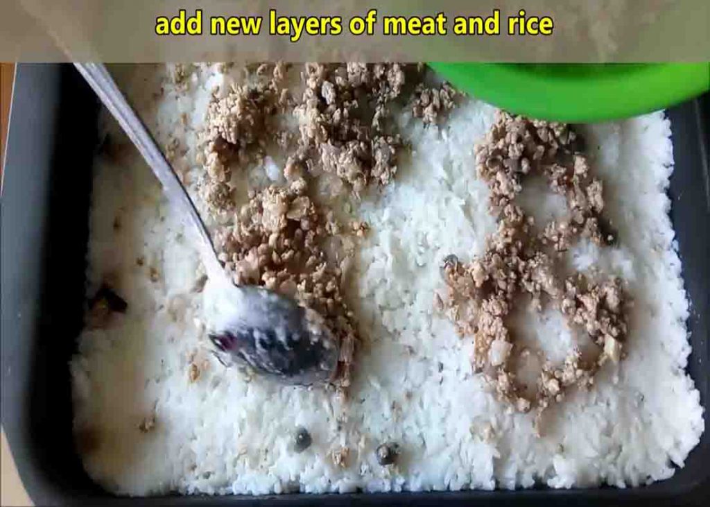 Assembling the layer of the ground pork and cabbage casserole