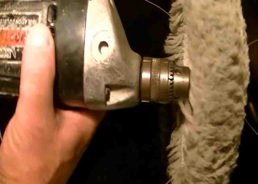 Attaching a buffing wheel to a drill for removing scratches out of glass stove top
