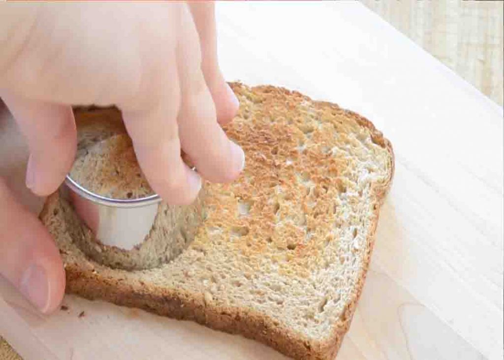 Cutting the toast for the bottom of the breakfast cups