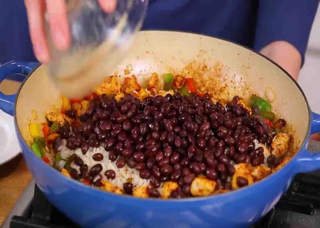 Cooking the beans and rice for the chicken fajita rice recipe