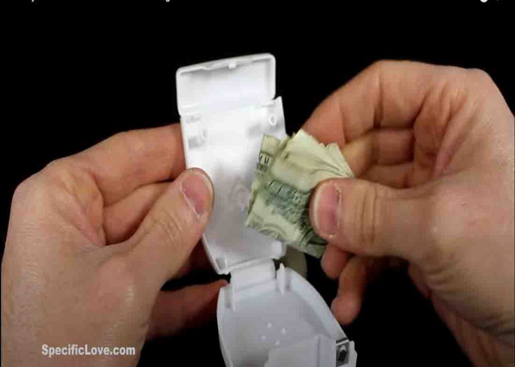 Hiding extra money inside a dental floss container