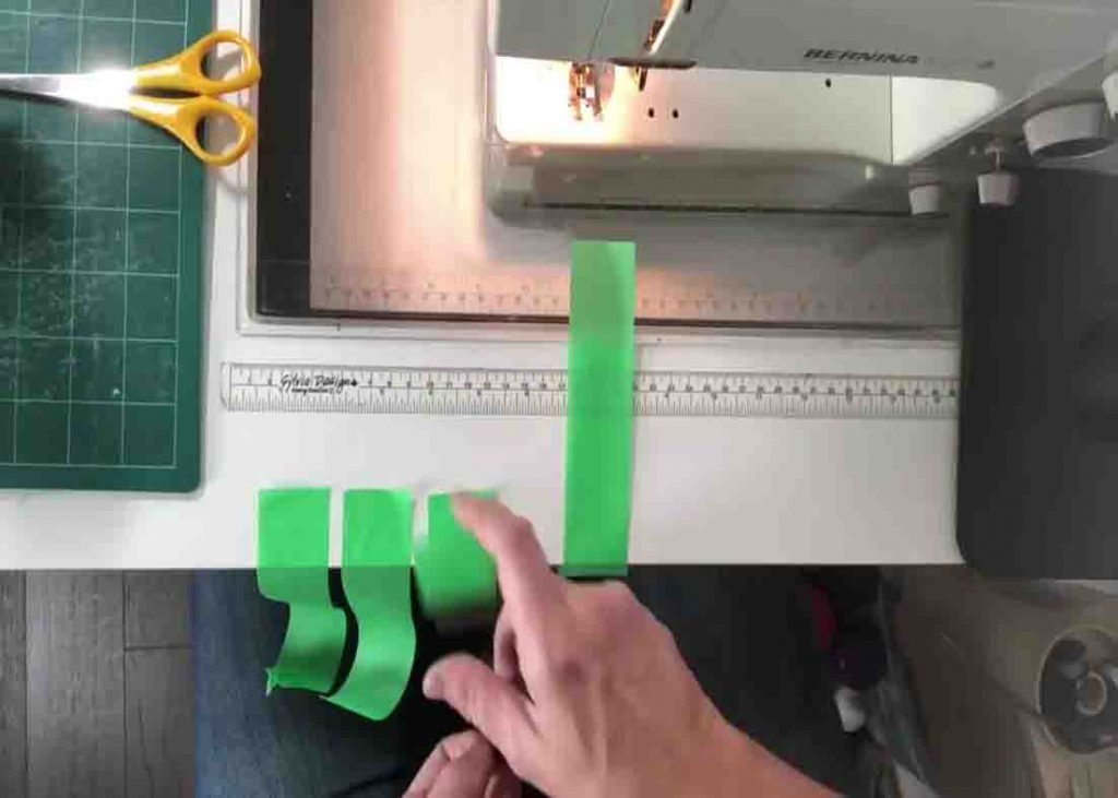 Using masking tape to mark the 1/4" seam on your sewing machine