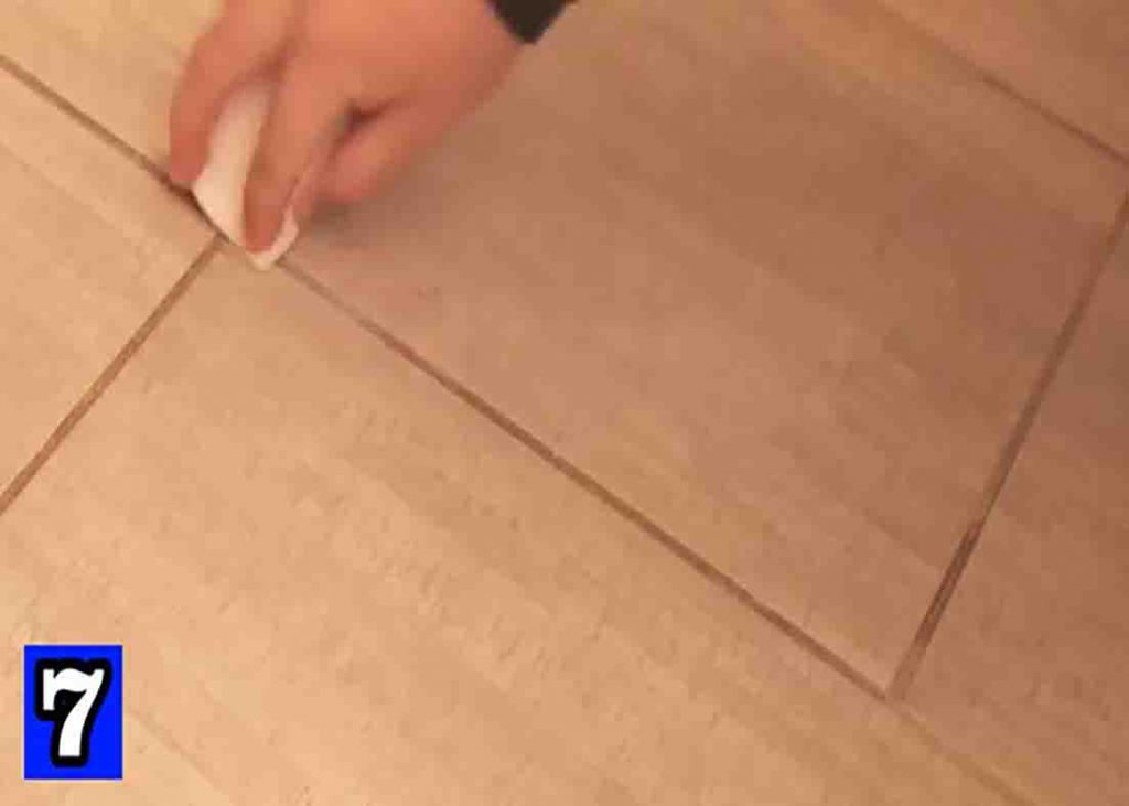 Cleaning the dirty grout lines with dirt erasers