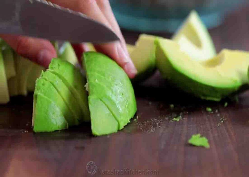 Slicing the avocado for the chicken salad recipe