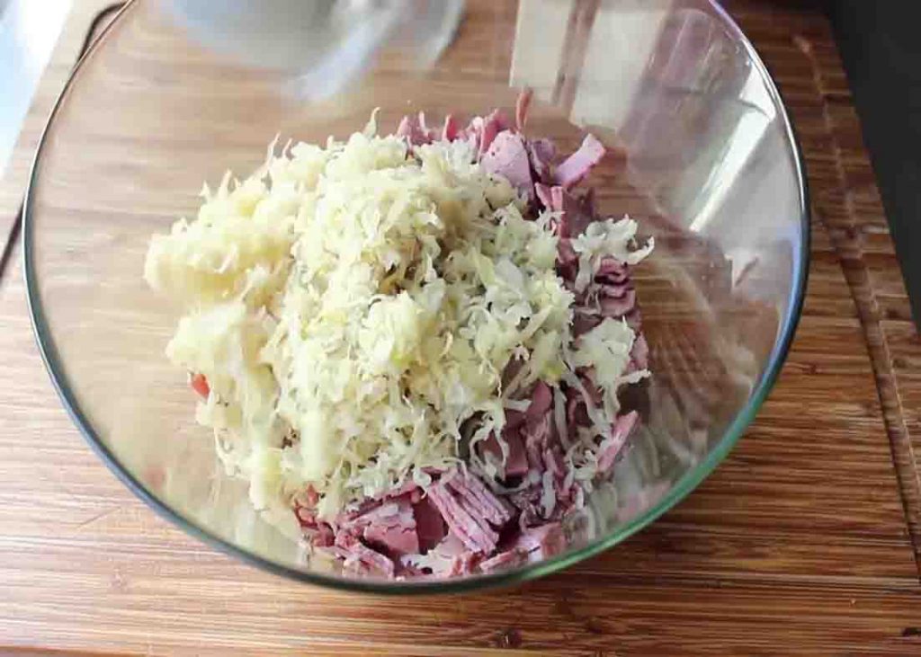 Mixing the ingredients for the baked reuben dip