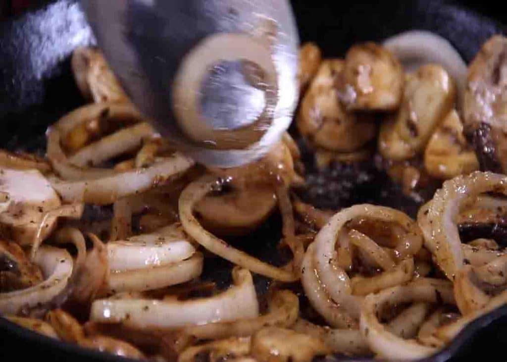 Sauteing the onion and mushrooms for the salisbury steak recipe