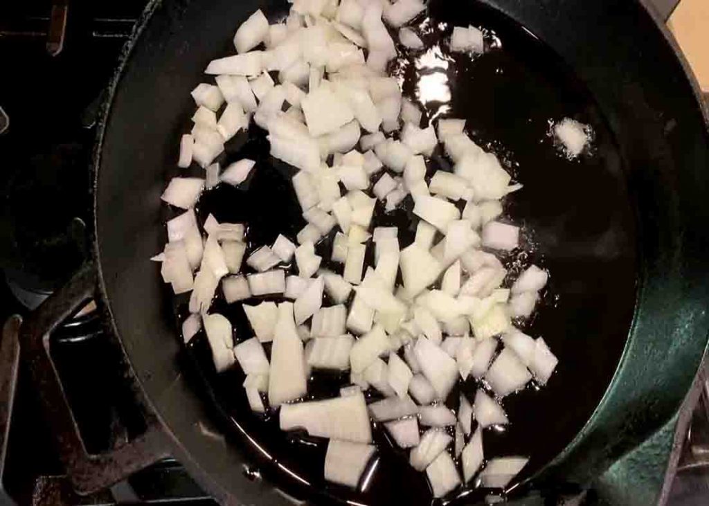 Sauteing the onions for the crispy breakfast potatoes recipe