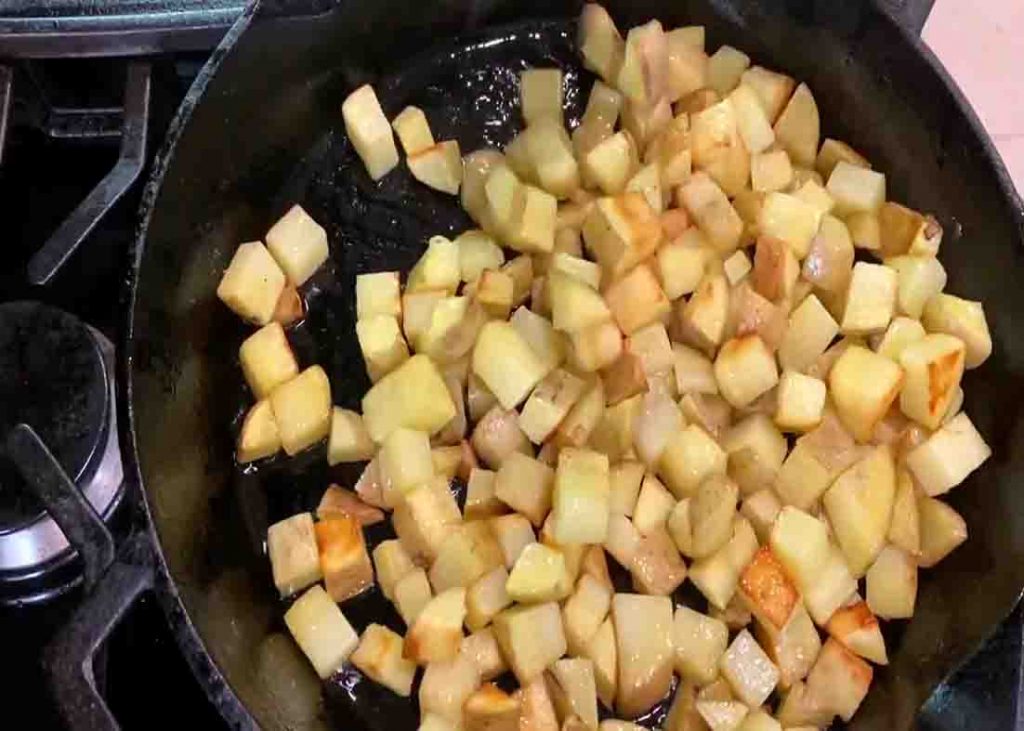 Frying the potatoes for the breakfast potatoes recipe