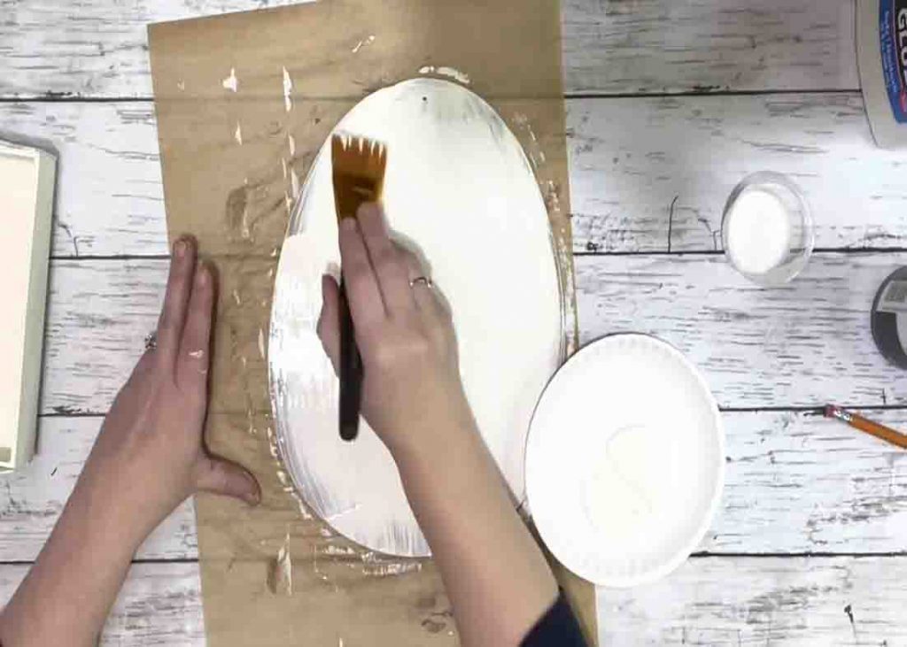 Painting the egg shape cutout from Dollar Tree