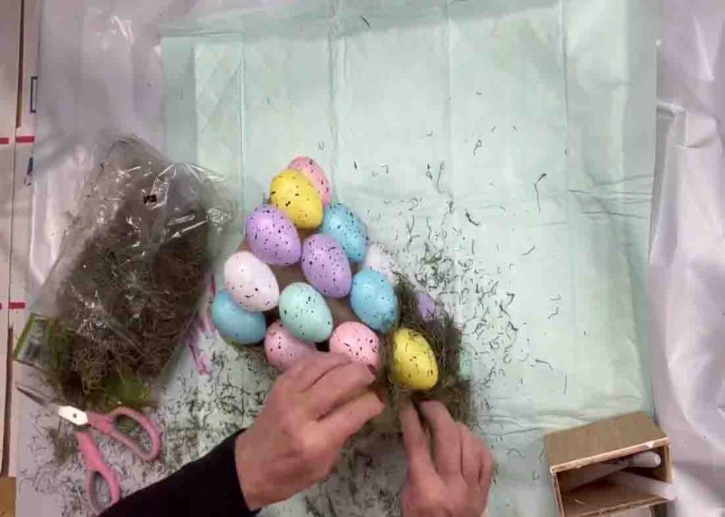 Gluing all the Easter eggs on the paper cone
