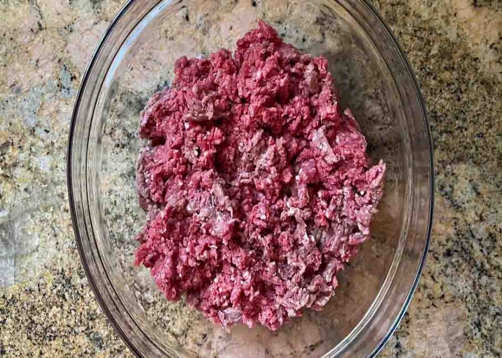 Preparing the ground beef for the foil packets recipe