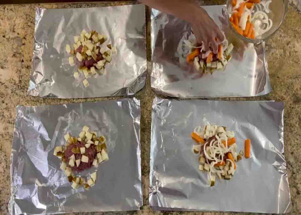 Dividing the veggies to the foil packets
