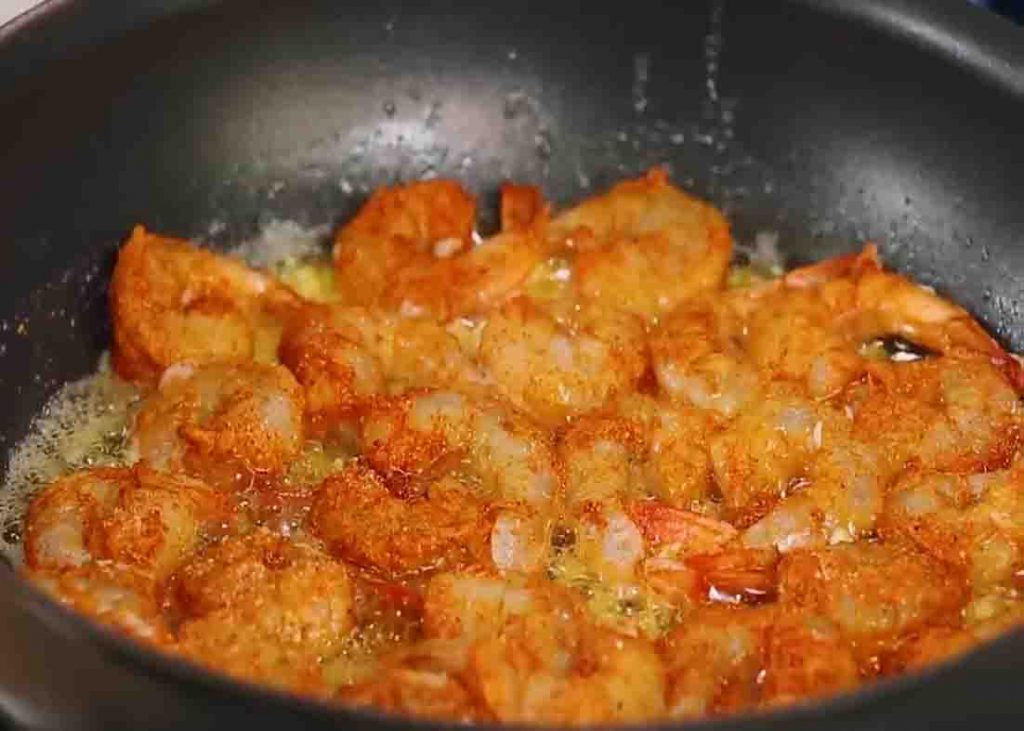 Cooking the Hawaiian-style shrimp