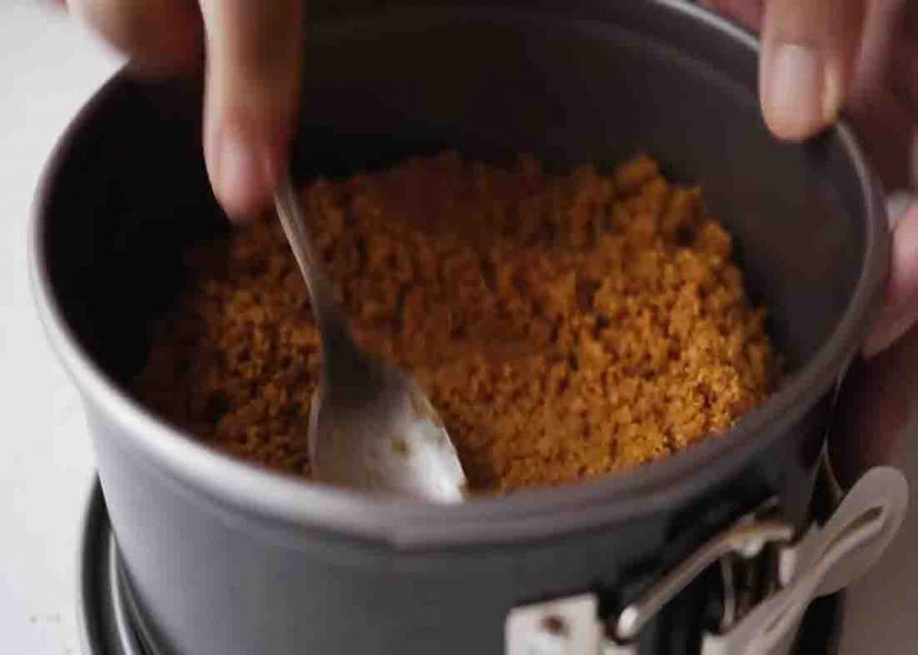 Making the crumb base for the no-bake vanilla cheesecake