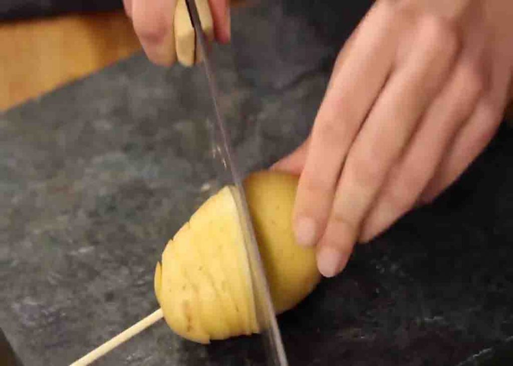 Slicing the potato in an angled way