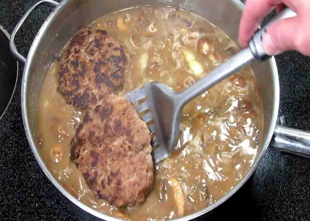 Smothering the steak in mushroom gravy