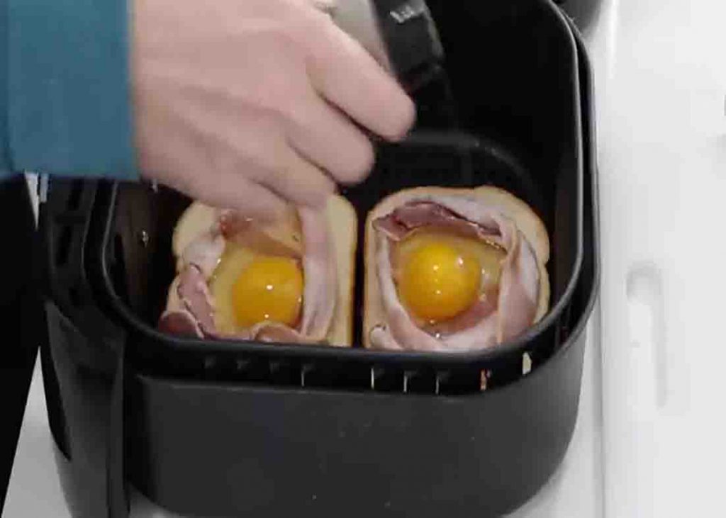 Seasoning the egg toast with salt and pepper